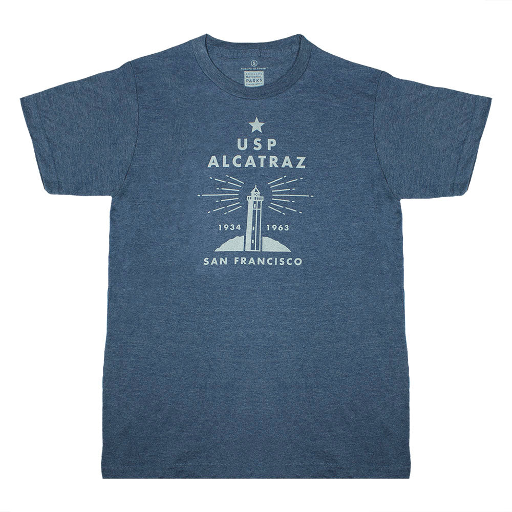 A navy blue t-shirt with 'USP Alcatraz' and a graphic of a lighthouse on it, screen-printed text and design.