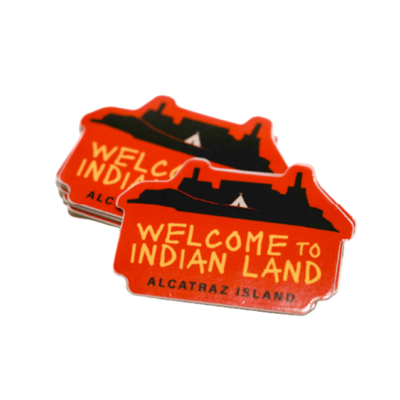 A stack of 'Welcome to Indian Land' Alcatraz Island stickers on a white background