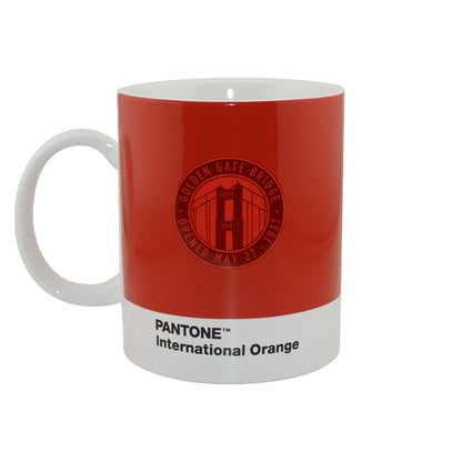 Red mug with a Golden Gate Bridge logo and 'Pantone International Orange' text on a white background 