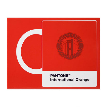Package gift box for Pantone International Orange Golden Gate Bridge mug, depicting red mug with white handle on a red background. 