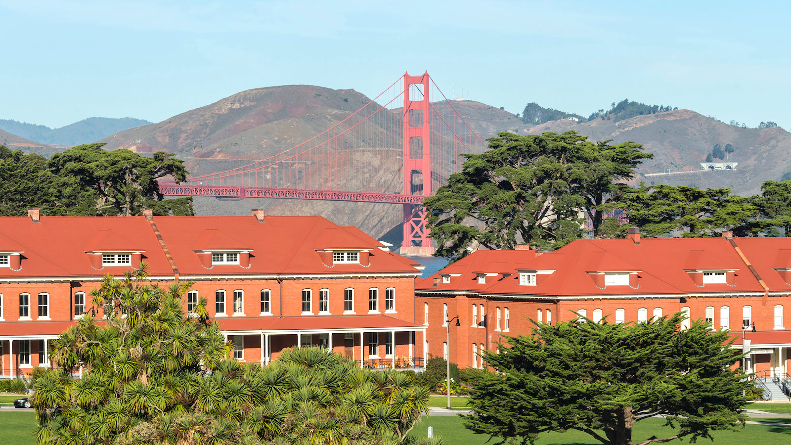 A view of the Montgomery Street Barracks of the Presidio of San Francisco, with the Golden Gate Bridge in the background