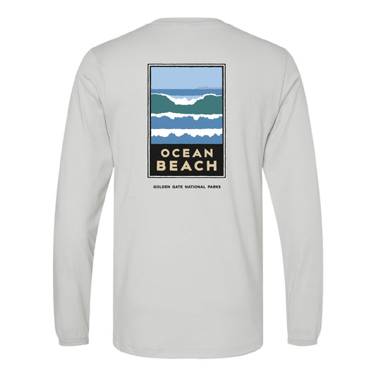 Screen printed Ocean Beach t-shirt by Golden Gate National Parks Conservancy, with art by Michael Schwab. White long-sleeve crewneck t-shirt with multicolor wave design.