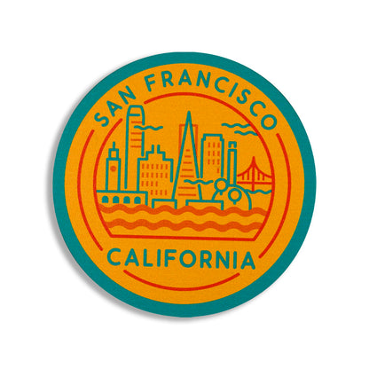 Round coaster with San Francisco, California text and cityscape illustration on a yellow background