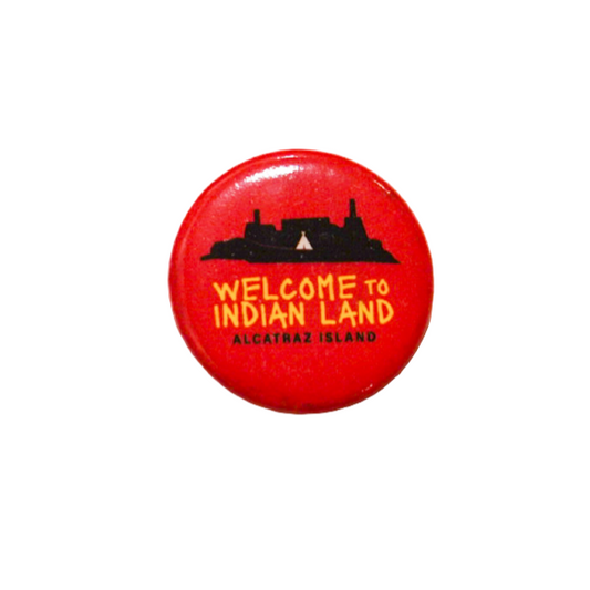 Red button with 'Welcome to Indian Land Alcatraz Island' text on a white background