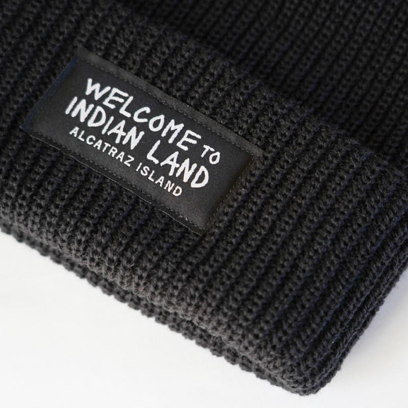 Black beanie with 'Welcome to Indian Land Alcatraz Island' patch