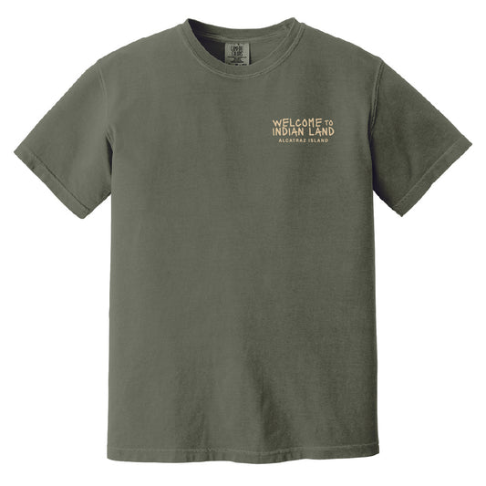Green t-shirt with 'Welcome to Indian Land' text in cream yellow