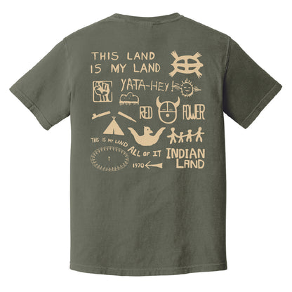 Green t-shirt with 'Welcome to Indian Land' exhibit text political statements