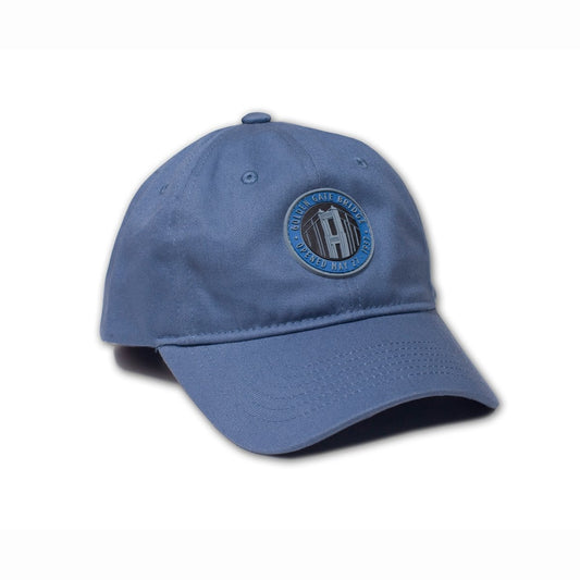 Blue baseball cap with Golden Gate Bridge design detail on front panels.