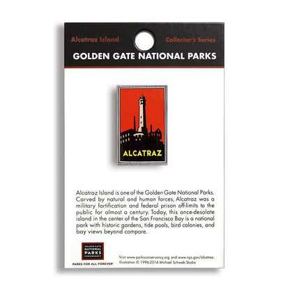A pin with an image of the Alcatraz lighthouse on a red background, labeled as part of the Collector's Series from Golden Gate National Parks.