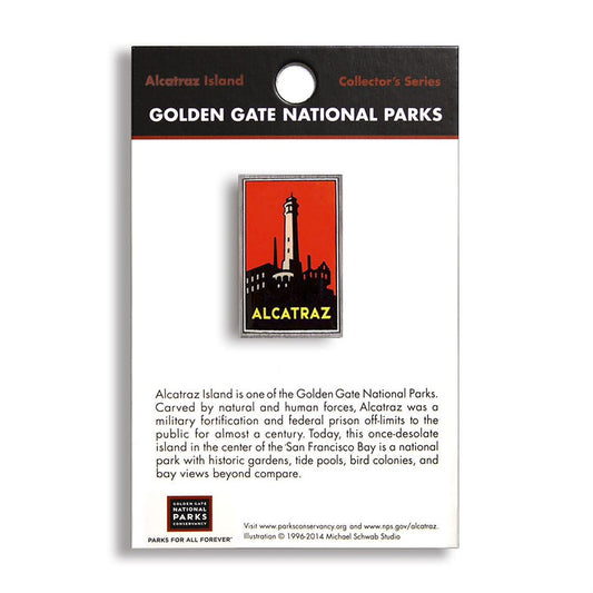A pin with an image of the Alcatraz lighthouse on a red background, labeled as part of the Collector's Series from Golden Gate National Parks.
